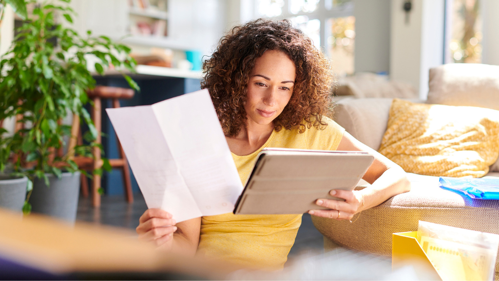 A presenter is reviewing their documents: Demonstrating preparation techniques for delivering an effective presentation.