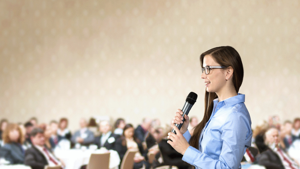 A presenter is giving a presentation: Showcasing effective public speaking skills and audience engagement techniques.